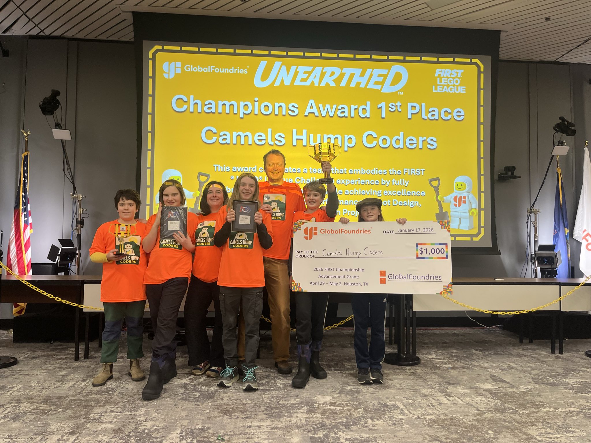 Camels Hump Coders holding the Champions Award and championship check