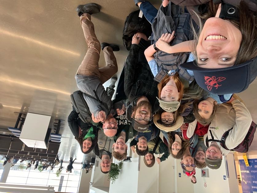 Team members and supporters posing together in Houston