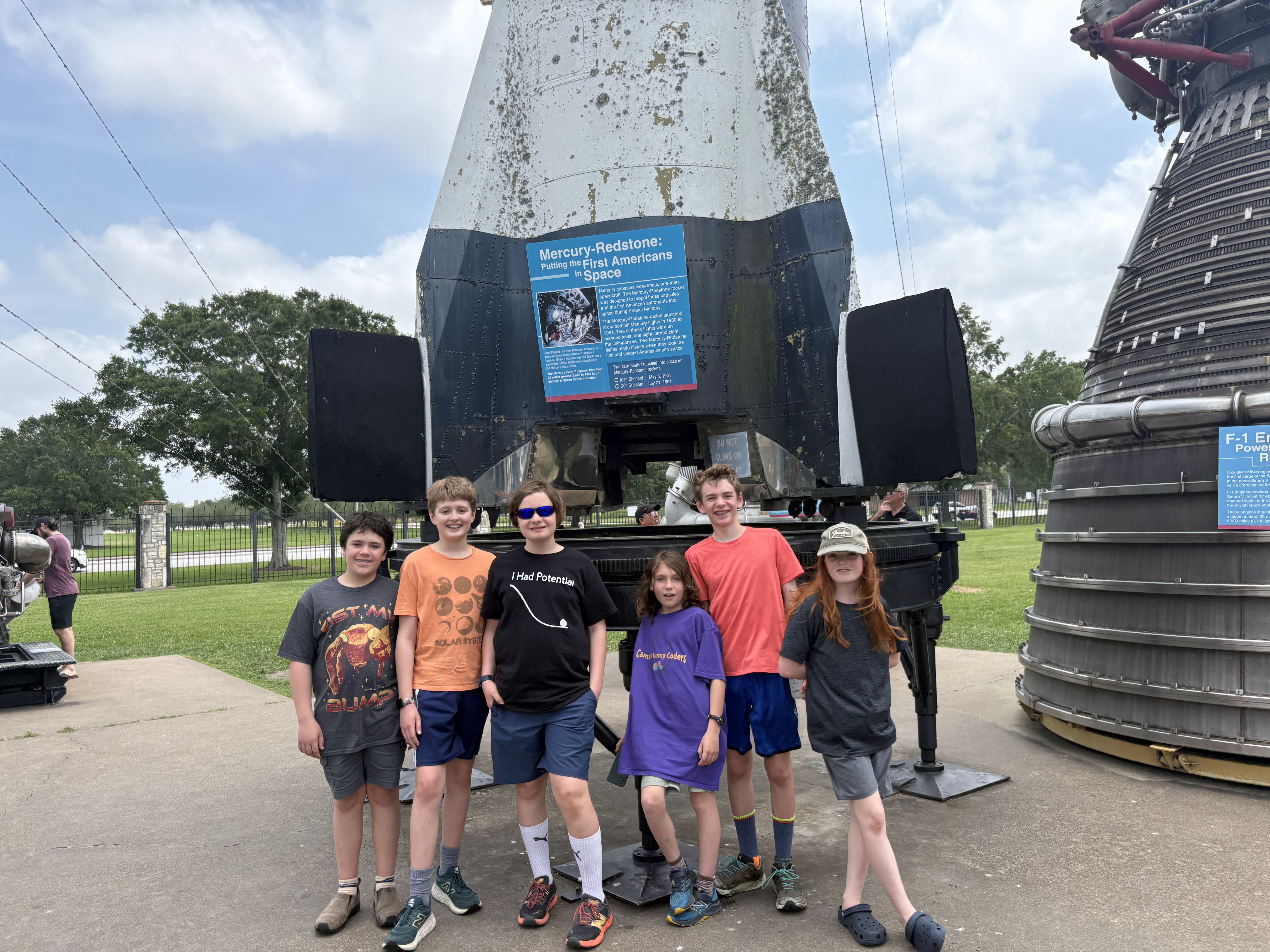 Team members visiting the Mercury-Redstone rocket display
